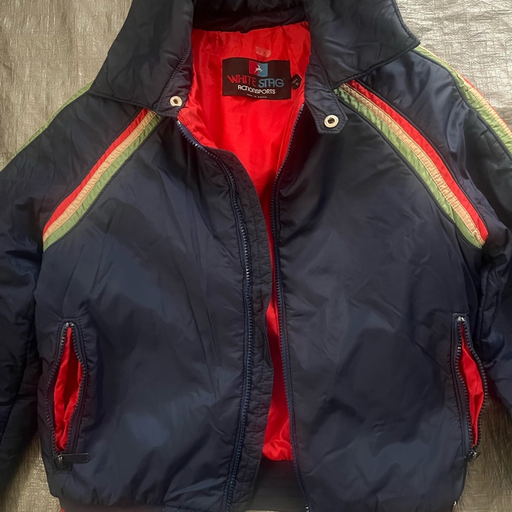 White Stag Navy Puffer Jacket with Red Lining and Green Accent